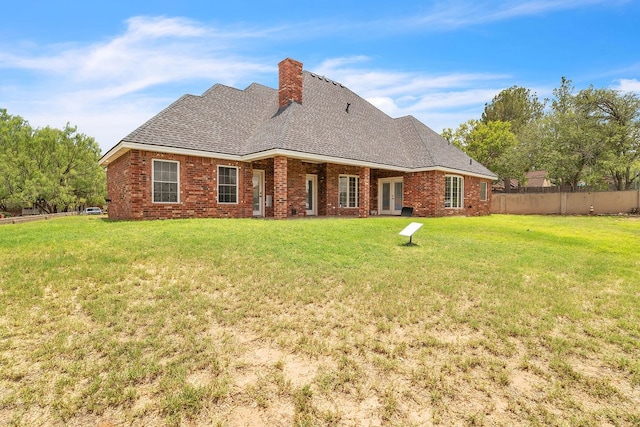 1 Kiowa Cir, Big Spring, TX 79720 - rear view of property with a chimney, brick siding, french doors, and a shingled roof