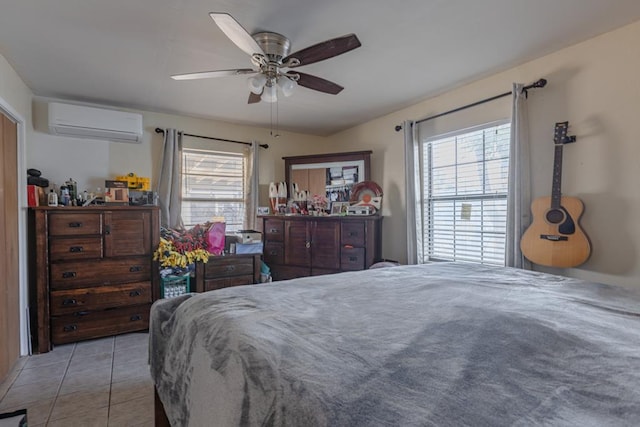 1304 Lynn Ave, Midland, TX 79705 - bedroom featuring a wall mounted AC, multiple windows, tile patterned flooring, and a ceiling fan