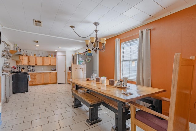 1304 Lynn Ave, Midland, TX 79705 - dining area featuring a chandelier and bar