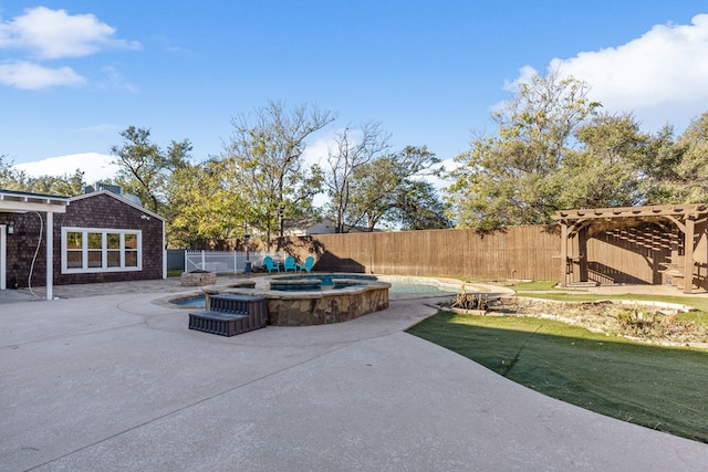 view of patio / terrace featuring a swimming pool with hot tub