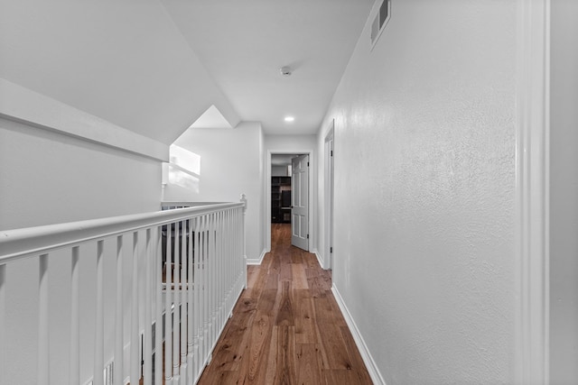 hallway with wood-type flooring