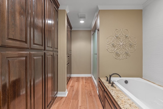 bathroom with separate shower and tub, crown molding, and hardwood / wood-style flooring