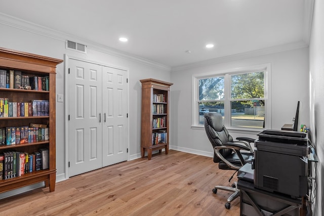 office space with crown molding and light hardwood / wood-style flooring