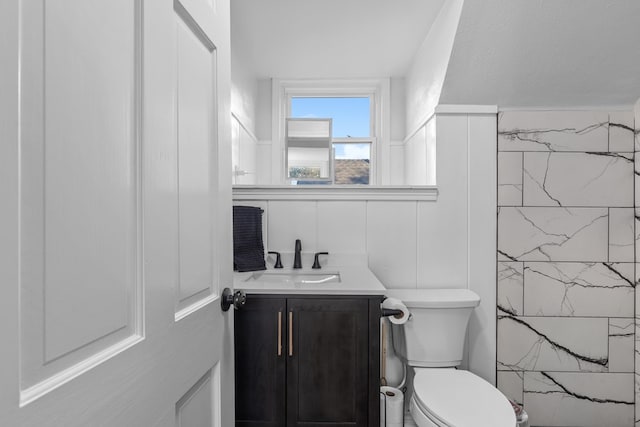 bathroom featuring vanity and toilet