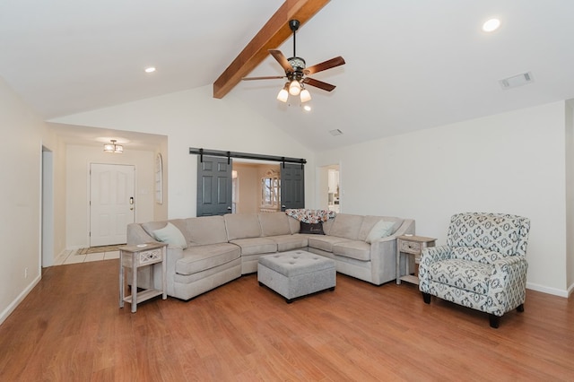 2429 S County Rd 1120, Midland, TX 79706 - living room with a barn door, a ceiling fan, beamed ceiling, wood finished floors, and recessed lighting