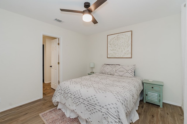 2429 S County Rd 1120, Midland, TX 79706 - bedroom with wood finished floors and a ceiling fan