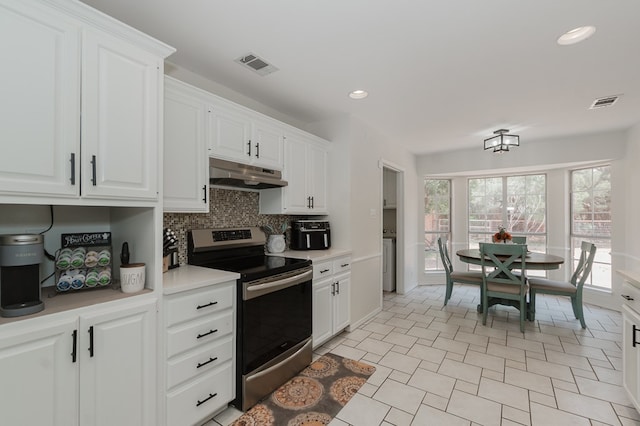 2429 S County Rd 1120, Midland, TX 79706 - kitchen featuring stainless steel electric stove, under cabinet range hood, backsplash, white cabinets, and light countertops