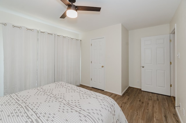 2429 S County Rd 1120, Midland, TX 79706 - bedroom with wood finished floors and a ceiling fan