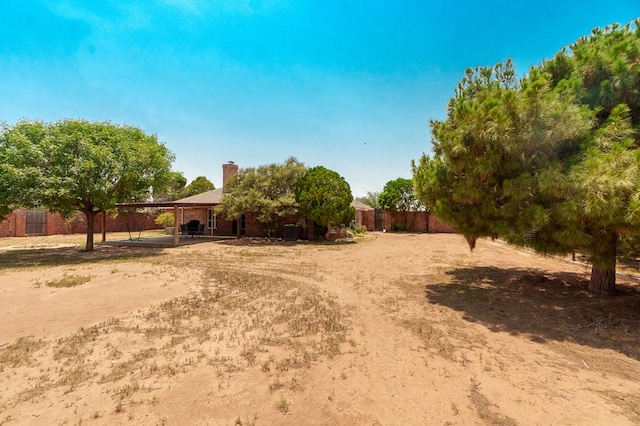 2429 S County Rd 1120, Midland, TX 79706 - view of yard featuring a patio area and a carport