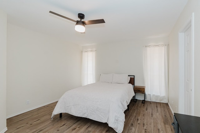 2429 S County Rd 1120, Midland, TX 79706 - bedroom featuring wood finished floors and a ceiling fan