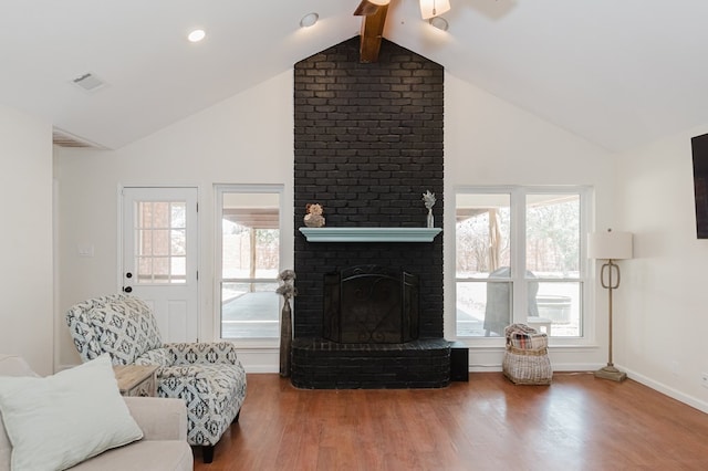 2429 S County Rd 1120, Midland, TX 79706 - living room with a ceiling fan, wood finished floors, healthy amount of natural light, and high vaulted ceiling