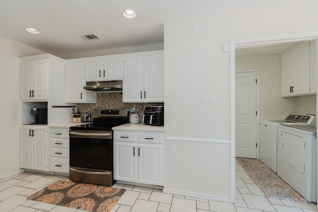 2429 S County Rd 1120, Midland, TX 79706 - kitchen with washing machine and clothes dryer, stainless steel electric range oven, under cabinet range hood, white cabinetry, and tasteful backsplash