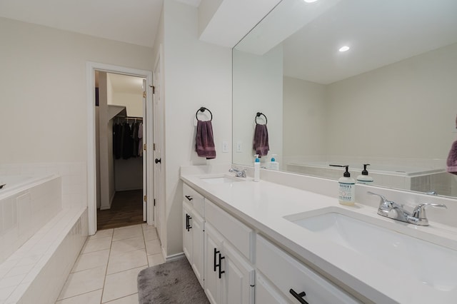 2429 S County Rd 1120, Midland, TX 79706 - bathroom with a garden tub, double vanity, tile patterned floors, and a walk in closet