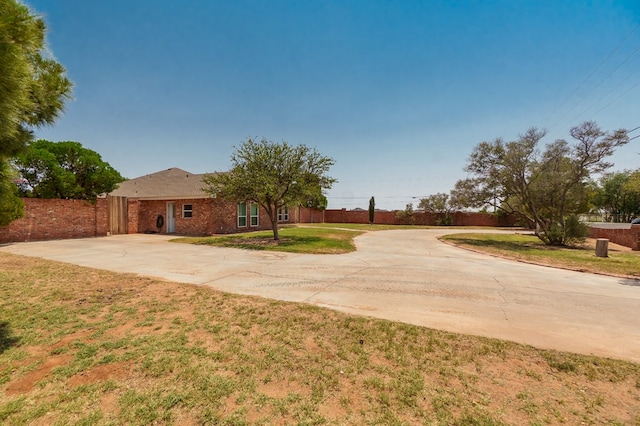 2429 S County Rd 1120, Midland, TX 79706 - single story home with concrete driveway and brick siding