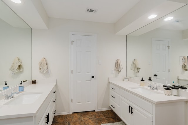 2429 S County Rd 1120, Midland, TX 79706 - full bath with baseboards and two vanities