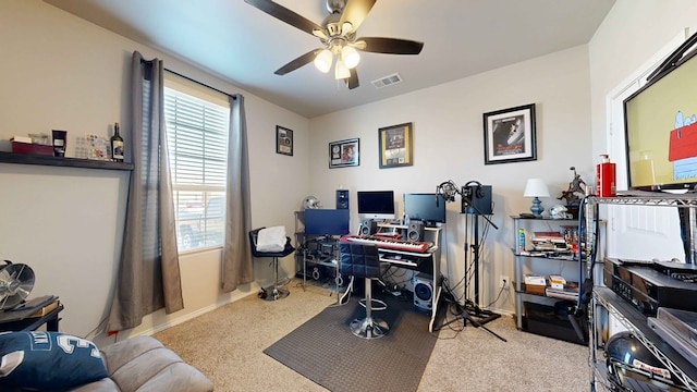 office area featuring ceiling fan and light carpet