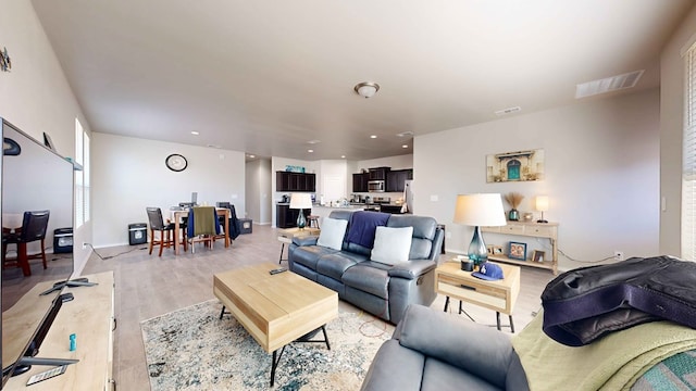 living room featuring light wood-type flooring