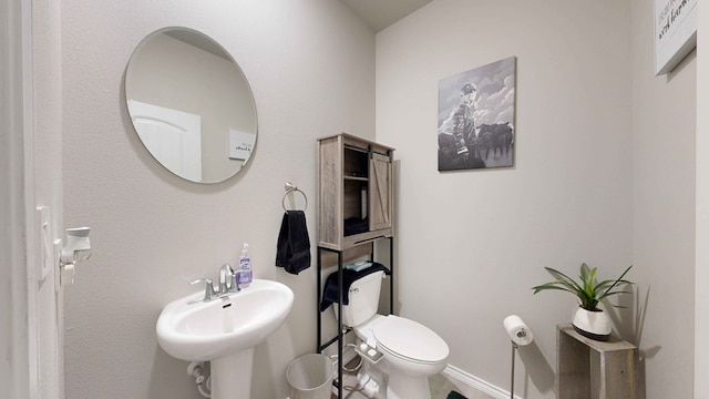 bathroom with sink and toilet