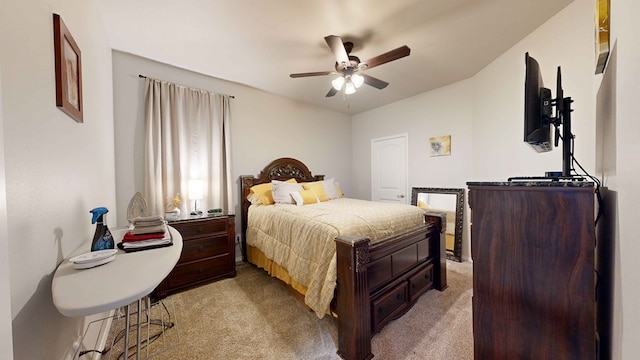 bedroom with ceiling fan and light carpet