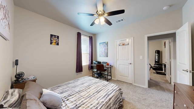 bedroom with ceiling fan and light carpet