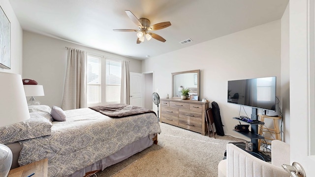 bedroom with ceiling fan and light colored carpet