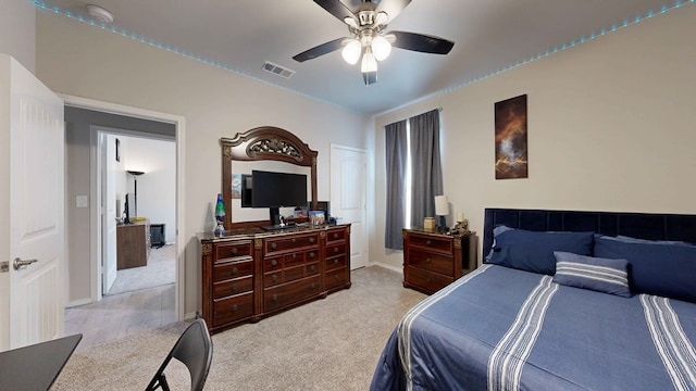 bedroom featuring ceiling fan and light colored carpet