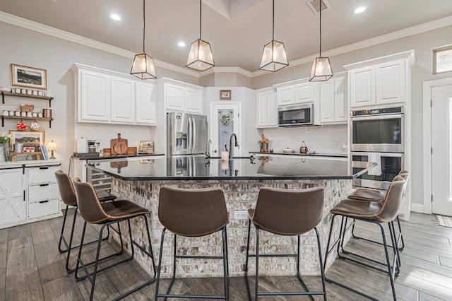 2900 S County Rd 1092, Midland, TX 79706 - kitchen with white cabinetry, appliances with stainless steel finishes, dark wood finished floors, and visible vents