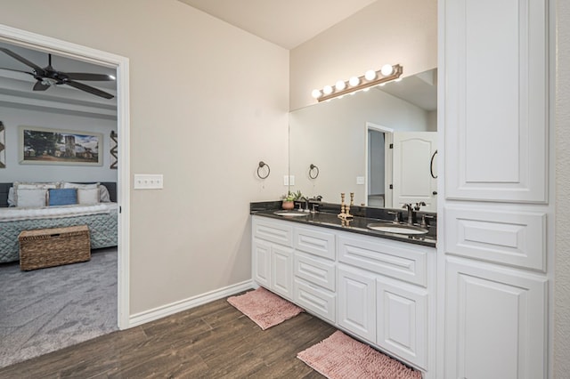 2900 S County Rd 1092, Midland, TX 79706 - ensuite bathroom with a sink, a ceiling fan, ensuite bath, and wood finished floors