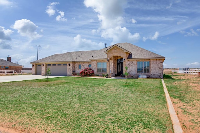 2900 S County Rd 1092, Midland, TX 79706 - single story home featuring a garage, fence, brick siding, a front lawn, and driveway