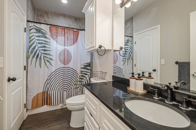 2900 S County Rd 1092, Midland, TX 79706 - bathroom featuring recessed lighting, vanity, toilet, and wood finished floors