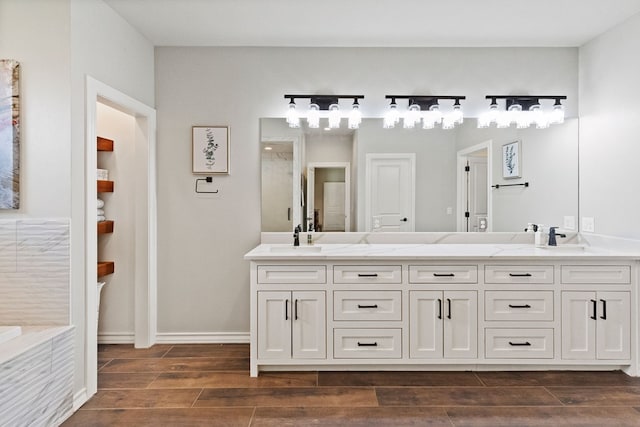 3100 Fairfield Ln, Midland, TX 79705 - bathroom with double vanity and wood finished floors