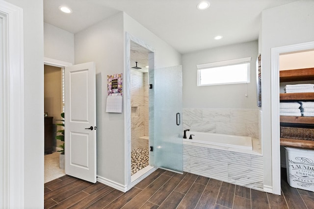 3100 Fairfield Ln, Midland, TX 79705 - full bathroom featuring a stall shower, a bath, wood finished floors, and recessed lighting