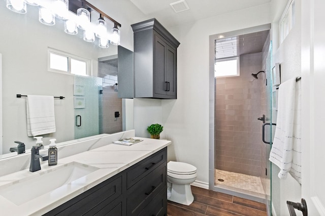 3100 Fairfield Ln, Midland, TX 79705 - bathroom with a shower stall, vanity, healthy amount of natural light, and toilet