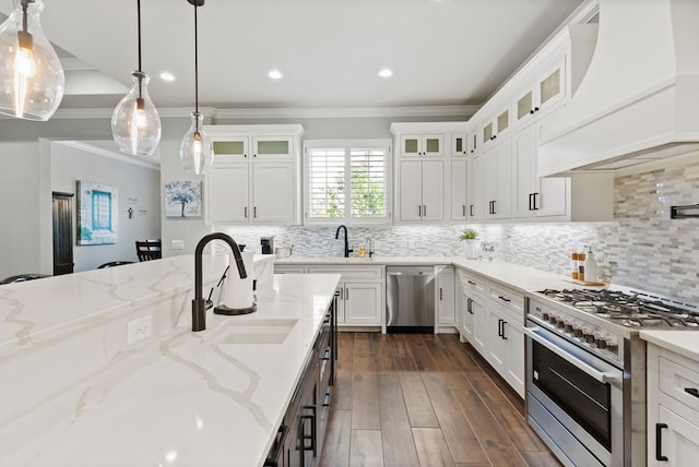 3100 Fairfield Ln, Midland, TX 79705 - kitchen with premium range hood, appliances with stainless steel finishes, a sink, ornamental molding, and white cabinetry
