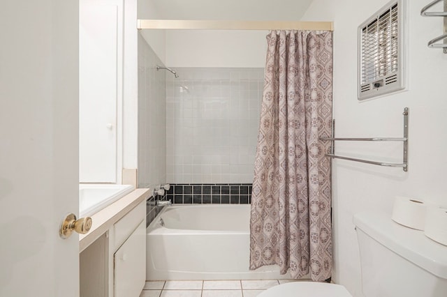 bathroom featuring shower / tub combo, tile patterned floors, and toilet