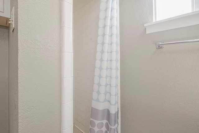 bathroom featuring walk in shower