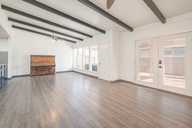 unfurnished living room featuring french doors, ceiling fan, dark hardwood / wood-style flooring, and beam ceiling