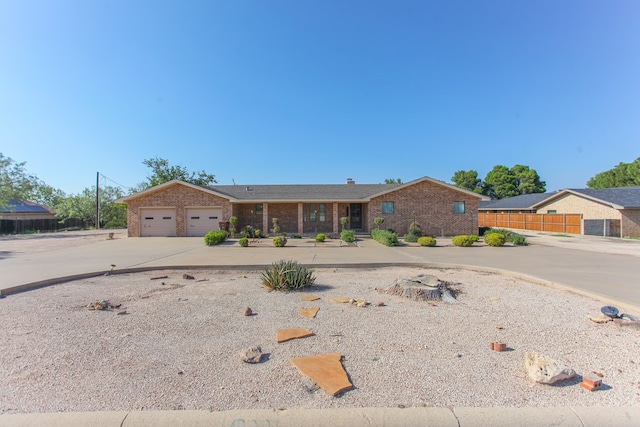 single story home featuring a garage