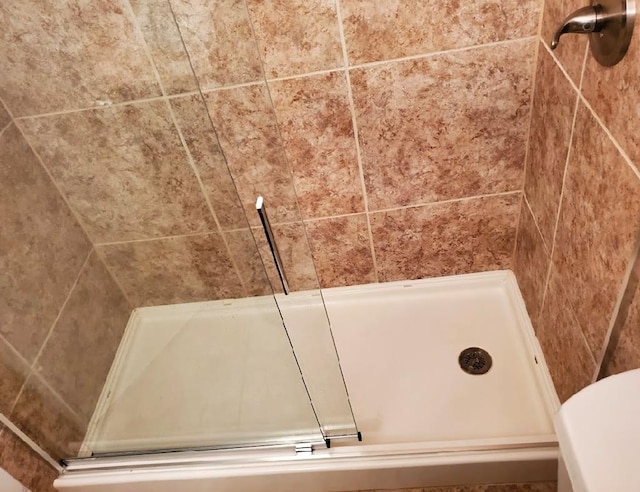 bathroom with an enclosed shower