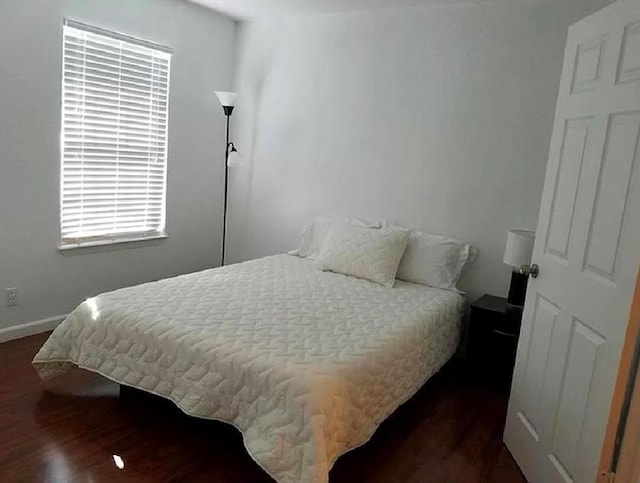 bedroom featuring dark wood-type flooring