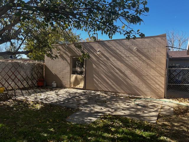 view of side of property with a patio area