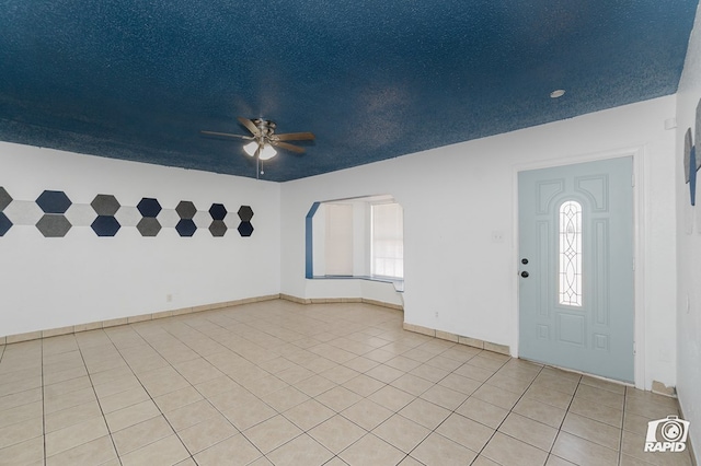 111 W Pine Ave, Midland, TX 79705 - foyer entrance featuring a ceiling fan, light tile patterned flooring, and arched walkways