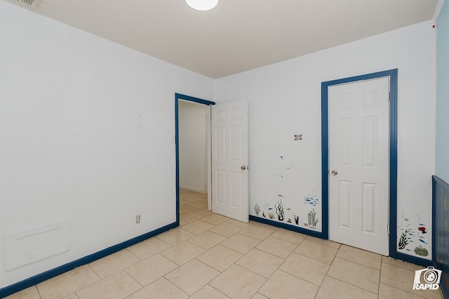 111 W Pine Ave, Midland, TX 79705 - unfurnished room featuring ornamental molding and light tile patterned floors