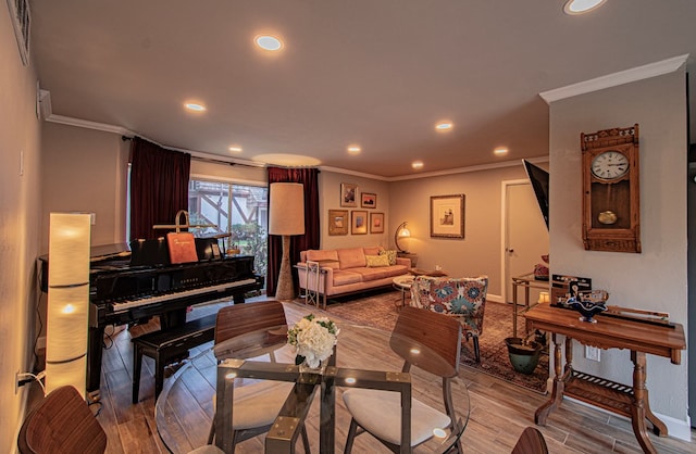 living room featuring crown molding and light wood-type flooring