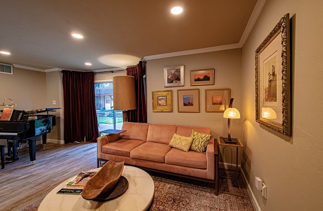 living room featuring hardwood / wood-style floors and ornamental molding