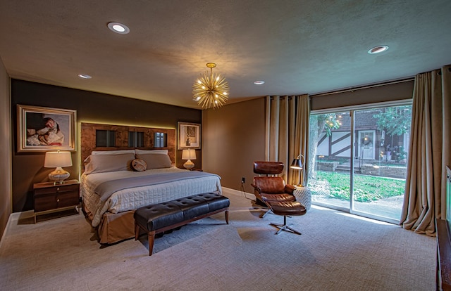 bedroom featuring access to exterior, light colored carpet, a textured ceiling, and a notable chandelier