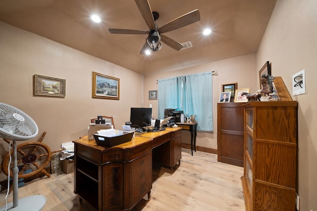 home office featuring vaulted ceiling, light hardwood / wood-style flooring, and ceiling fan