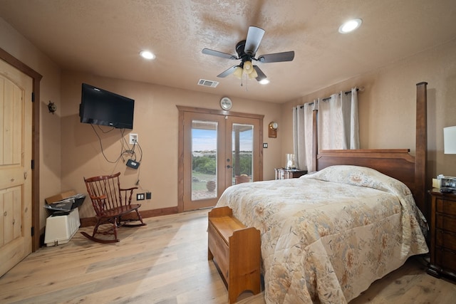 bedroom with french doors, ceiling fan, access to exterior, light wood-type flooring, and a textured ceiling