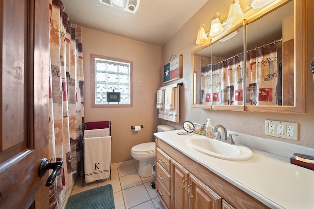 bathroom with tile patterned flooring, vanity, a shower with shower curtain, and toilet