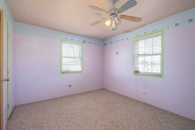 carpeted empty room with ceiling fan